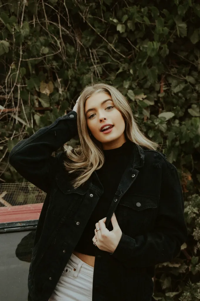 unsplash_GFoYfREqLg8_black denim jacket women.jpg.webp